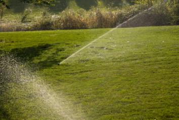 in ground sprinklers in Cedar Hill Texas irrigate a lawn